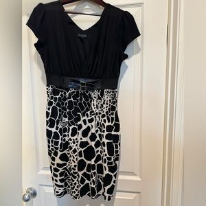 Black and white dress with pockets on both sides.